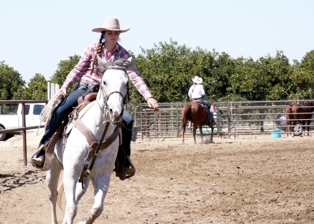 Austyn Campbell on her dapple grey,  Gravity, running poles during a rodeo in Filmore, Calif. Photo: Danielle Moor