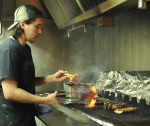 Victor Sierra ,26, Prepares BBQ Ribs for  The Rib Ranch restaurant on October 4, 2014 in Woodland Hills Calif.