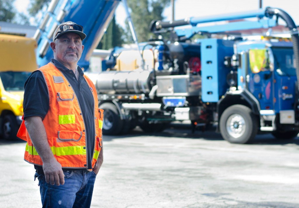 Kent Carlson poses in front of a Hydro Truck in the Wastewater Collection Systems Division in Tarzana on March 02, 2015. A Hydro truck is mounted with a 1,500-gallon water tank and a 800ft. Hydro hose used for pumping out 2,000 pounds per square inch of water into the sewer lines. Photo by David Paz